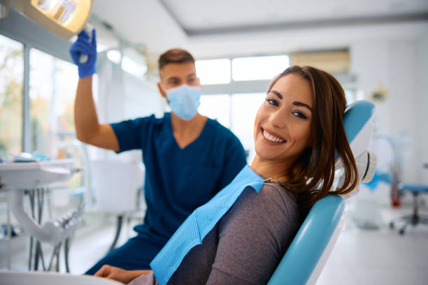 Dentist and smiling patient in modern dental practice